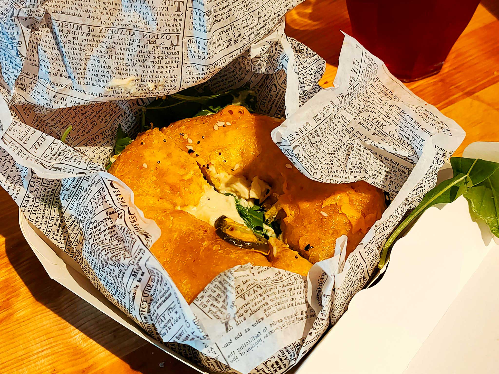 Jalapeño bagel in paper wrap
